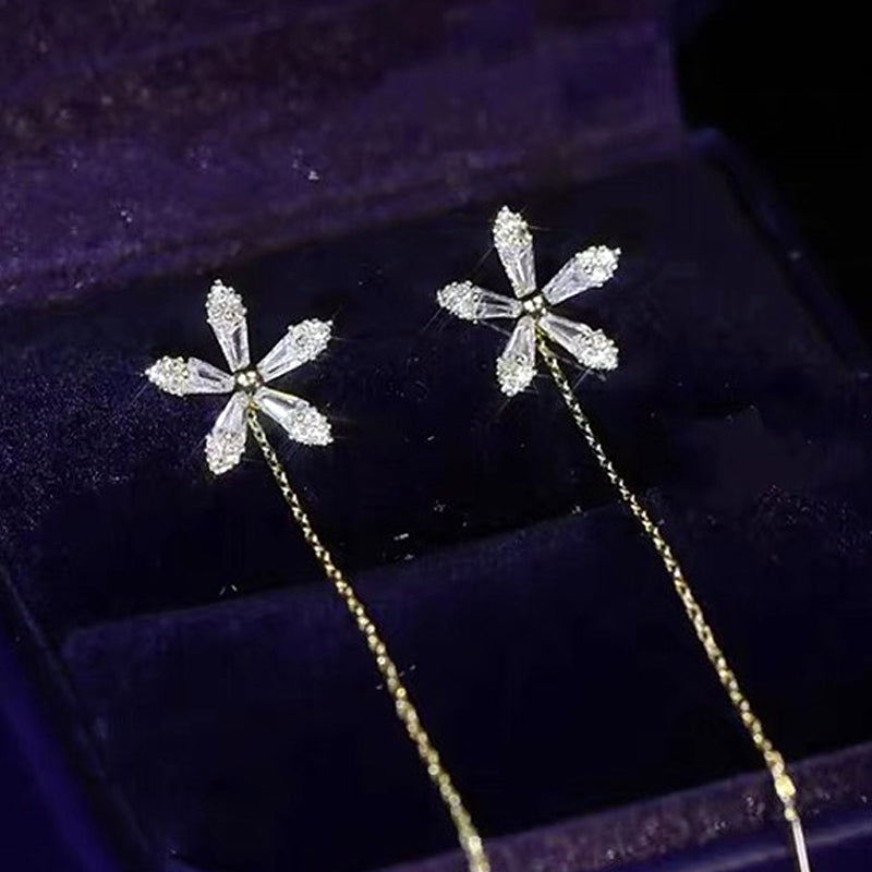 Blomsterörhängen med glänsande fransar